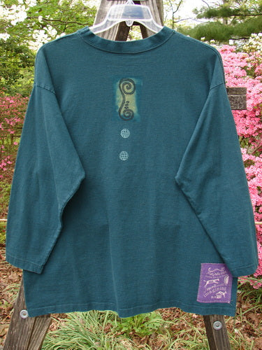 Vintage 1996 Long Sleeved Tee from BlueFishFinder in Viridian. Features a Blue Fish Patch, Mixed Verticals Theme, and Thick Ribbed Neckline. Made of Organic Cotton Jersey. Size 1.