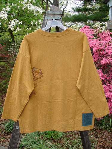 Vintage 1996 Long Sleeved Tee featuring Falling Heart design in Old Gold, Size 2. Heavy Organic Cotton Jersey with Dropped Shoulder, Ribbed Neckline, and Blue Fish Patch. Bust 52, Waist 52, Hips 62, Length 29 Inches.