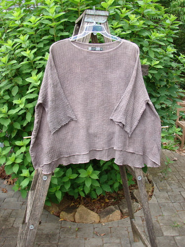 Barclay Crinkle Gauze Top Mottled Steaming Latte OSFA displayed on a hanger, showcasing its wide, boxy silhouette with three-quarter-length dolman sleeves and a varied high-low hem.