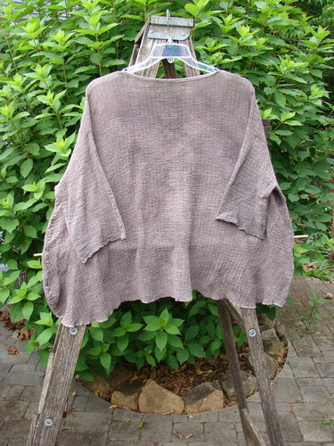 Barclay Crinkle Gauze Top Mottled Steaming Latte OSFA showcased on a wooden stand, highlighting its high-low hemline, three-quarter dolman sleeves, and soft texture, embodying BlueFishFinder's unique, vintage-inspired style.