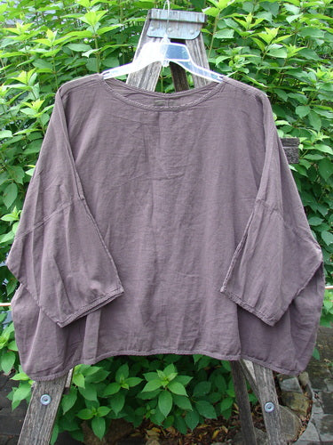 Barclay Twill Atmosphere Overlayer Boxy Top Unpainted Stick OSFA displayed on a hanger, showcasing its flowy, boxy shape and three-quarter length dolman sleeves, embodying Bluefishfinder.com's vintage, expressive style.