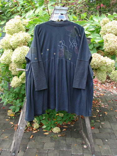 Barclay Thermal Bungalow Jacket Modern Graphics Black OSFA displayed on a ladder, highlights include a deep V-neckline with wooden buttons, gathered flounce, and abstract print, representing Bluefishfinder.com's vintage-inspired creative fashion.