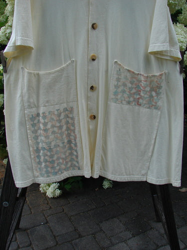 2000 Double Decker Pocket Top: a white shirt with oversized pockets stacked on top of each other, pleated back line and signature Blue Fish Patch.