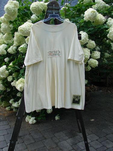 2000 Double Decker Pocket Top Pastel Fence Milk Size 2: A white shirt with two oversized pockets stacked on top of each other, pleated back line, and a swing.