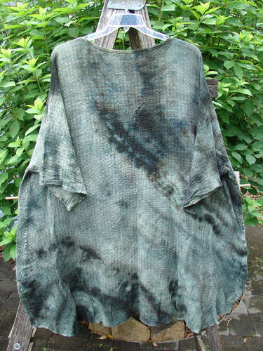 Barclay Crinkle Gauze Ana Tunic Dress Unpainted Mottled Forest OSFA on a rack, showcasing its wide three-quarter sleeves, seamless shoulders, and varying hemline, embodying Bluefishfinder.com's vintage aesthetic.