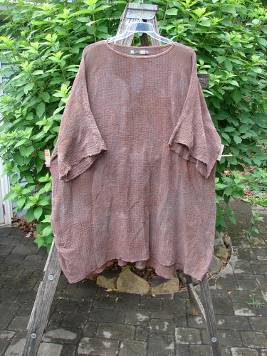Barclay Crinkle Gauze Ana Tunic Dress Unpainted Mottled Copper OSFA displayed on a wooden rack, showcasing its wide three-quarter sleeves and varying hemline. The lightweight cotton gauze reflects Bluefishfinder.com's vintage aesthetic.