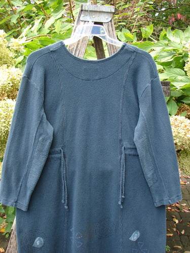 1999 Thermal Home Dress Paisley Peacock Size 0 on wooden ladder, showcasing squared neckline, rectangle elbow patches, sectional panels, and subtle art near hem. Features draw cords and a slight empire waistline.