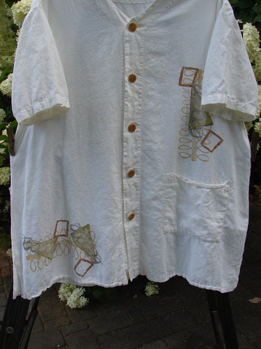 2000 Hemp Viscose Asymmetric Top: White shirt with brown buttons. Full button front, V-shaped neckline, side vented hem, drop pocket. Size 1.