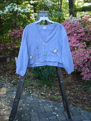 Vintage 1999 Weathervane Jacket in Iris, Size 2, featuring a V-shaped neckline, mix-match buttons, and a garden lunch theme paint. Perfect condition linen piece from BlueFishFinder's collection of unique, expressive clothing.