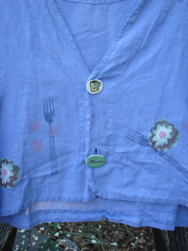 Vintage 1999 Weathervane Jacket featuring a Summer Garden Lunch theme in Iris. Made from handkerchief weight linen, with unique front buttons, porcelain accents, and a V-shaped neckline. Size 2. By BlueFishFinder.