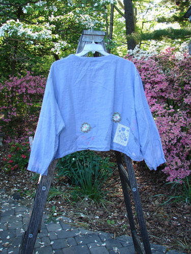 Vintage 1999 Weathervane Jacket in Iris, Size 2, featuring a V-shaped neckline, unique front buttons, and a rounded side hem. From BlueFishFinder, empowering women's individuality through Vintage Blue Fish Clothing.