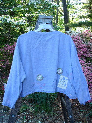 Vintage 1999 Weathervane Jacket in Iris, Size 2, featuring a V-neck, unique buttons, and a summer garden lunch theme. Made of handkerchief weight linen. From BlueFishFinder, a hub for Vintage Blue Fish Clothing.