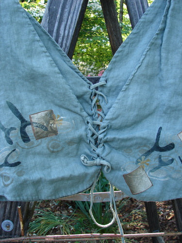 1997 Beachcomber's Vest Undersea Lagoon Size 2, close-up showing intricate front lacing and undersea theme paint, boxy crop shape, perfect for layering, double-lined for texture.