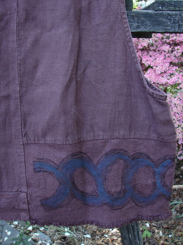Close-up of the 2000 Poet's Vest Celtic Loam Size 1, featuring a unique feather edge pocket, double-paneled hemline, metal buttons, and Celtic-themed accents.