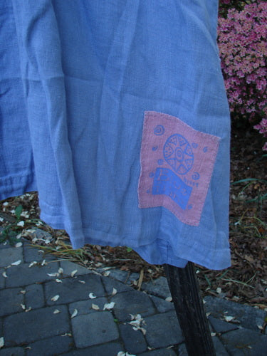 Vintage 1999 Thyme Top in Unpainted Iris, Size 2, from BlueFishFinder.com. Handkerchief Linen fabric with A-line shape, tabbed back swing, vented sides, and oversized buttons. Perfect condition. Dimensions: Bust 56, Waist 60, Hips 66, Length 33.