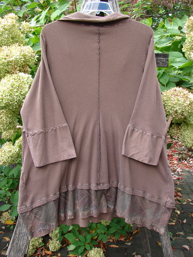 Barclay Thermal Flutter Neck Kangaroo Pocket Top Leaf Mud Size 0: Back view of a loose-fit cardigan with three-quarter sleeves, center seam, sheer lace-hem ruffle, displayed against a natural backdrop.