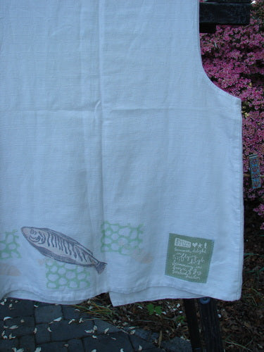 A vintage 1999 Textured Linen 2 Pocket Vest from BlueFishFinder in Natural. Features a fish patch, A-line shape, oversized front pockets, and pearl buttons. Bust 16, Waist 44, Hips 50, Length 30.