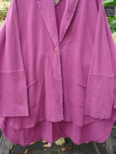 Barclay NWT Reprocessed Golden Hour Jacket Rear Folk Garden Pokeberry OSFA: A loose-fitting, mid-length jacket with wide sleeves, single button closure, and patch pockets, featuring a layered hem and dense cotton texture.
