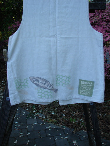 Vintage 1999 Textured Linen 2 Pocket Vest featuring a whimsical fish patch on natural fabric. A-line silhouette with oversized front pockets and pearl buttons. Perfect for summer. From BlueFishFinder's collection.