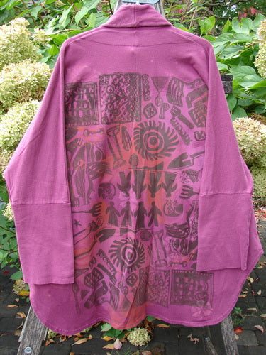 Barclay NWT Reprocessed Golden Hour Jacket Rear Folk Garden Pokeberry OSFA, featuring abstract motifs on the back, long sleeves, dolman shoulders, and oversized pockets, displayed against a natural outdoor backdrop.