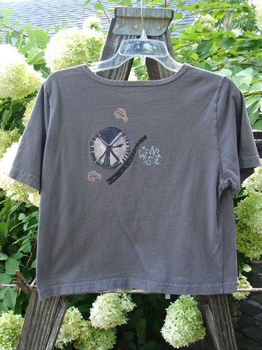 1996 KIDS Short Sleeved Tee Travel Truck Granite Size Medium: A grey t-shirt with a picture of a vintage farm truck theme paint on it.