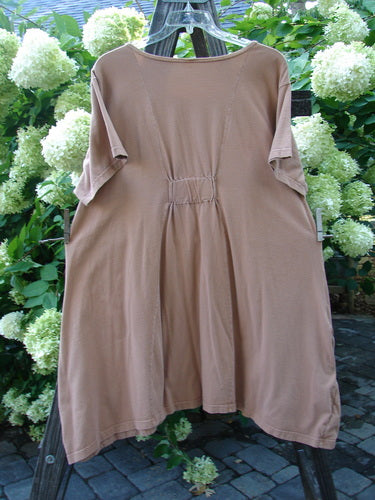 Image alt text: Barclay Farmer Jen Tunic Dress, a brown shirt with artichoke garden theme paint, oversized front drop pockets, and a deeper rounded neckline.