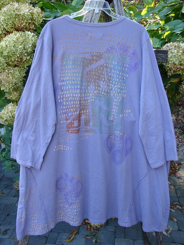 Barclay Art Studio Roo Sweatshirt Rear Rain Garden Lavender OSFA features a loose, metallic-gold dotted tunic with abstract pastel motifs, rounded neckline, external stitchery, drop kangaroo pocket, and high-low hem.