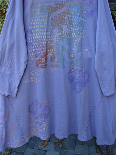 Barclay Art Studio Roo Sweatshirt Rear Rain Garden Lavender OSFA draped on a bench, showcasing its high-low hem, external stitchery, and subtle leaf motifs, epitomizing Bluefishfinder.com's vintage-inspired expressive fashion.