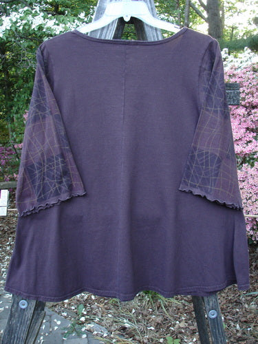 Barclay Three Quarter Grid Sleeved A Line Top Plum Size 1, a vintage Blue Fish creation by Jennifer Barclay. A purple shirt with fluttery edged sleeves, a deep neckline, and a linear grid pattern on sleeves.