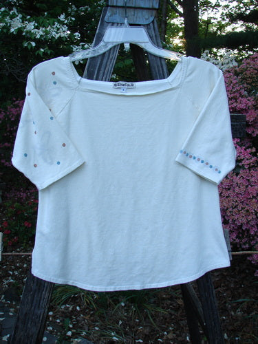 2001 Boatneck Top Dot to Dot Fizz Size 1 displayed on a hanger, showcasing short sleeves, a shallow boatneck, playful dot-to-dot paint pattern, and a rounded hemline.