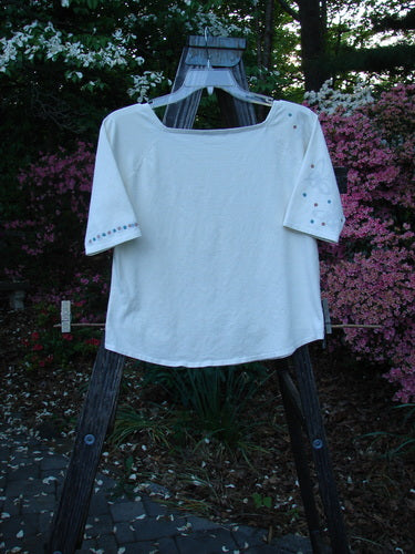 2001 Boatneck Top Dot to Dot Fizz Size 1 displayed on wooden stand, showcasing painted short sleeves, shallow boatneck, playful dot pattern, and rounded hemline.