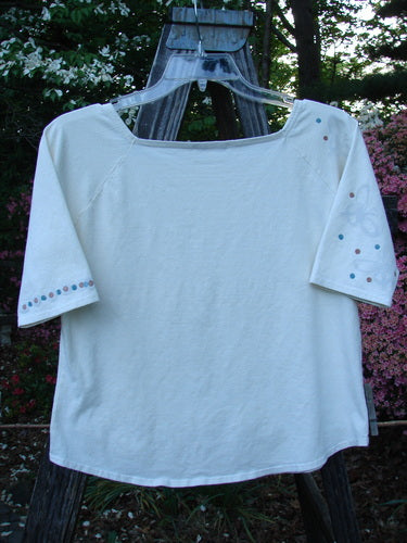 2001 Boatneck Top Dot to Dot Fizz Size 1 displayed on a hanger, featuring painted short sleeves, a shallow boatneck line, and playful dot patterns, perfect for layering and a fitted feel.