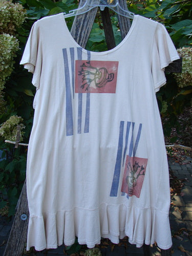1996 Butterfly Dress Garden Path Birch Bark Size 1, featuring short flutter sleeves, a scooped neckline, and a ruffled hem, with stylized plant motifs and stripe blocks, displayed on a hanger outdoors.