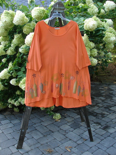 Image alt text: "Barclay Hi Low Tunic Top in Tangerine, size 2, on a rack"