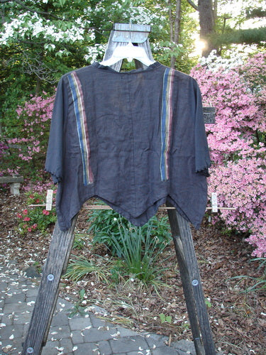 Barclay NWT Linen Scallop Crop Grid Jacket Black Stripe Size 1, a vintage Blue Fish creation by Jennifer Barclay. Features include a fluttery collar, scalloped hemline, and pearly buttons. Image shows shirt on a hanger with blue poncho.