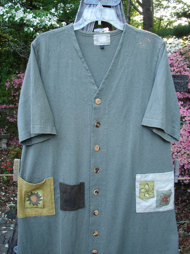 2000 Cotton Hemp 3 Block Cardigan Sun Pocket Loden Size 1 displayed on a hanger, featuring patchwork pockets, a V neckline, and colorful painted accents.