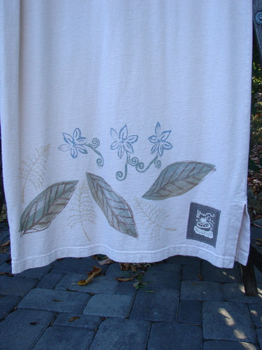 1999 Straight Dress Window Chair Teadye Size 0, featuring a botanical motif with stylized flowers and leaves, draped over a stone surface with scattered leaves, highlighting its unique Blue Fish signature patch.