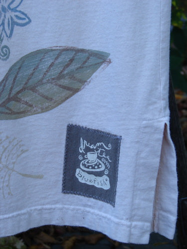 1999 Straight Dress Window Chair Teadye Size 0 features a stylized leaf print, side slit, and signature dream factory bluefish patch on the hem. A classic vintage piece from Bluefishfinder.com.
