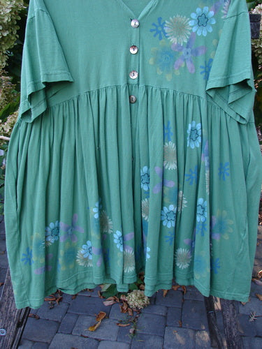 Barclay Tree Top Cardigan Dress Floral Blossom Spearmint Size 3 displayed outdoors, features a flared skirt, gathered empire waist, and vintage buttons, showcasing a sweet peasant style with floral motifs.