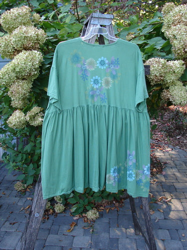 Barclay Tree Top Cardigan Dress Floral Blossom Spearmint Size 3 hanging outdoors on a wooden ladder rack, featuring vintage buttons, a V neckline, and floral prints on organic cotton.