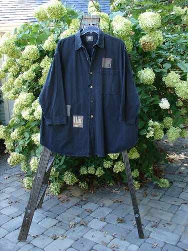 1998 Limited Edition Men's Patched Denim Work Shirt Black Size 2, featuring metal button front, breast pocket, and unique patches.