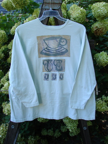 1999 Long Sleeved Tee with Tea Cup Design: Mint condition, size 2. Soft, organic cotton shirt featuring a teacup and teapot design.