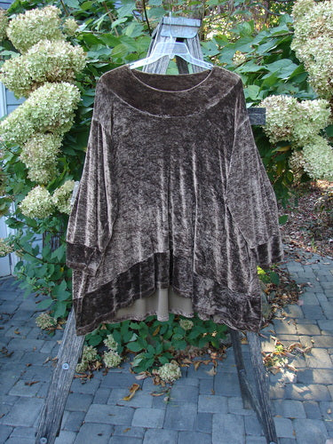 1997 Velvet Surya Top Subtle Celtic Border Mandorla OSFA, displayed on a wooden ladder, showcasing its draped, swingy shape with a scooped front and rounded sides, against lush hydrangeas.