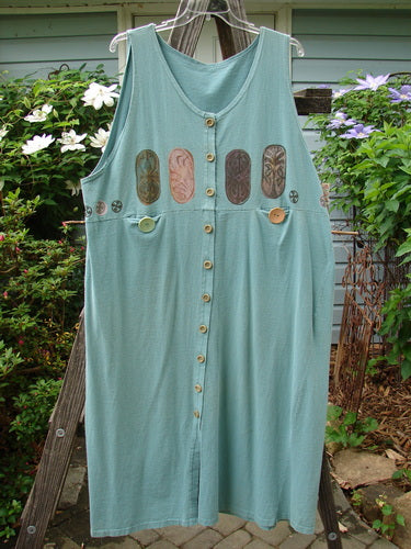 Vintage 1993 Button Jumper with Wooden Rimmed Buttons, Tunnel Pockets, and Carved Stone Theme Paint. Ocean Blue, Size 2. From BlueFishFinder, a hub for Vintage Blue Fish Clothing by Jennifer Barclay.