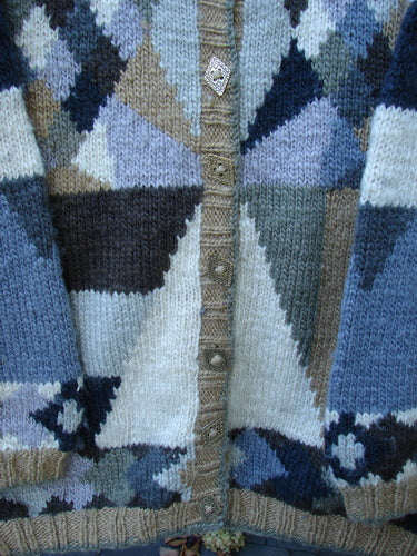 Tara Handknits Diamond Button Oversized Cardigan Geometric Naturals OSFA features a geometric, color-blocked pattern with a ribbed hem and unique diamond-shaped buttons, showcasing vintage craftsmanship from a women's cooperative.