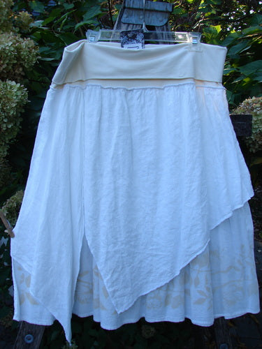 Barclay NWT Linen Fold Over Generosity Skirt Leaf Field Fresh White Size 2, featuring a layered design with an asymmetrical draped outer layer, smooth waistband, and vine-themed painted batiste under layer.