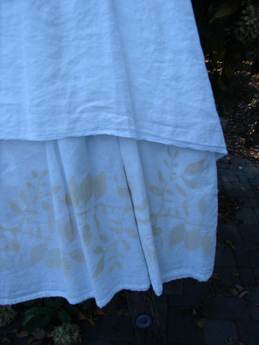 Barclay NWT Linen Fold Over Generosity Skirt Leaf Field Fresh White Size 2, elegantly hangs outdoors, showcasing its layered, stenciled leaf pattern and unique fold-over waist, embodying Bluefishfinder.com's vintage charm.