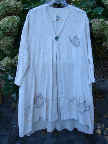 1999 NWT Cream and Sugar Coat Tea Time Teadye OSFA, featuring a V-neck with oversized shell button, long sleeves, flared hem, and teapot motifs, perfect for expressing individuality with vintage charm.