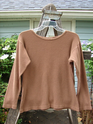 1997 Long Sleeved Thermal Top Unpainted Copper Size 1 displayed on a hanger, showcasing its thick cotton waffle fabric, continuous neckline stitchery, and slightly tapered waistline.