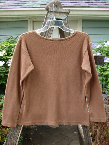 1997 Long Sleeved Thermal Top in Unpainted Copper Size 1, displayed on a hanger, showcasing its thick cotton thermal fabric, continuous neckline stitchery, and slightly tapered waistline.